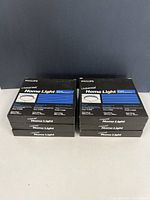 Stack of six sealed Philips Universal Home Light Circline bulb boxes