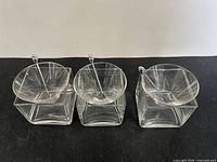 Top view of the three martini glass sets showing bowls, cube bases and olive picks