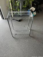 Front view of assembled chrome wire rack showing two shelves
