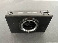 Front view of Olympus PM-C35DX body showing lens mount and controls