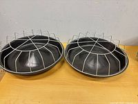 Two identical feeding trays side by side