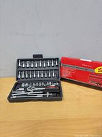 open case showing all 46 pieces including ratchet, sockets, bits and accessories