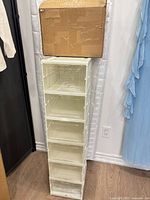 Example stack of six assembled shoe boxes with shipping carton on top