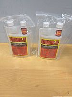 Two sealed Biobor JF bottles in bags