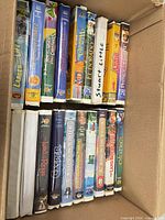 Open box showing two rows of VHS tapes