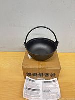 Pot on top of box with instruction leaflet