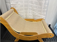 Side view of assembled wooden cat lounge chair with woven seat