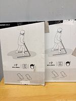 Front view of both sealed Decathlon Oxelo walker boxes