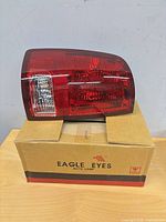 Tail lamp on top of branded Eagle Eyes box