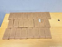 Top view of 25 stacked Smofish cable clip combo pack boxes