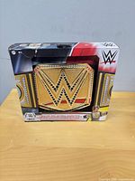 Front view of boxed WWE championship toy belt