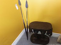 Full view of accent table and two spears