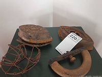 Group shot of two sad irons, iron rest and wire basket