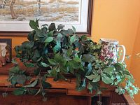 Overall lot showing both ivy arrangements and decorative pitcher