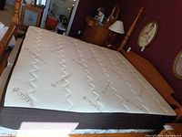Full view of king mattress on bed frame showing top surface