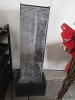 Full view of grey plastic cascading fountain