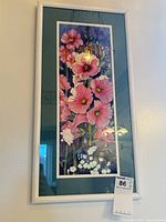 Full view of framed floral watercolour in white frame with teal mat, MaxSold tag visible