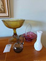 All four glass items grouped on table