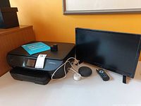 All items: HP Envy 5660 printer, Insignia 19-inch TV with remote, Google Home Mini with adapter