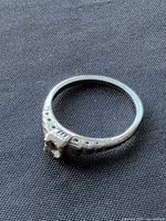 Full view of ring band and empty prong setting