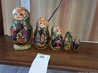 Full set of five nesting dolls displayed in size order
