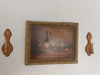 Front view showing painting and both candle sconces