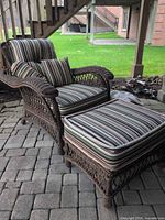 Recliner and ottoman set with cushions outdoors on patio