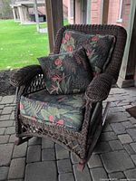 Front view of Hauser rattan rocking chair with cushions