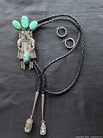 Full view bolo tie with hoop earrings