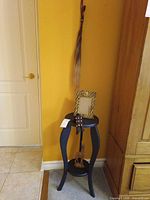 Overall shot of table holding frame, fly swatter and gazelle