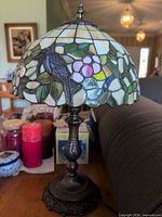 Full view of Tiffany style stained glass lamp on table