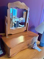 front view of wood tabletop vanity mirror and box