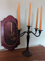 Painting and candelabra displayed together