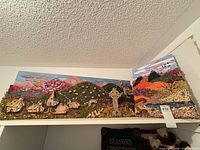 Both 3D artworks on shelf showing overall views