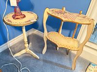 Both accent tables against blue wall