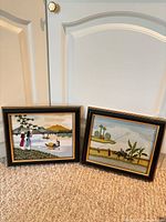 Both framed silk embroideries side by side