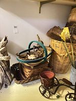 Group shot of baskets, bicycle planter, galvanized vase, driftwood