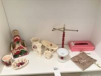 Group shot of all bathroom décor items lined on shelf