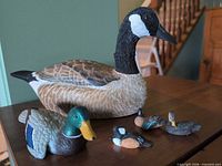 All five carved duck figures on table