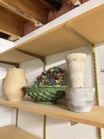 Shelf view showing all four ceramic pieces together