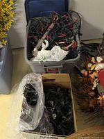 Tote and bankers box filled with assorted Christmas light strings