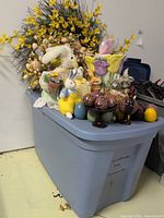 Overall lot showing tote, wreaths, vase, eggs, plush bunnies