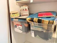 Two totes with fabric, patterns box, cushion visible