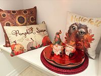 Group shot showing pillows, charger plates, placemats, gnome statues