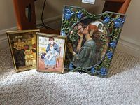 All three framed prints standing on carpet