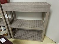 Front view of two-tier plastic shelving unit