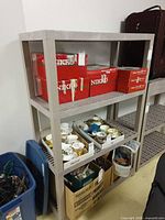 Full view of plastic shelving unit with contents demonstrating scale