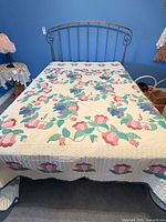quilt spread on bed showing overall pattern