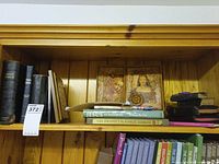 Shelf with assorted Bibles, Jesus of Nazareth, The Prophet, canvas wall hanging
