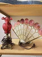 Both lamps side by side on shelf